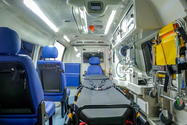 Inside an ambulance car with medical equipment for helping patients before delivery to the hospital.